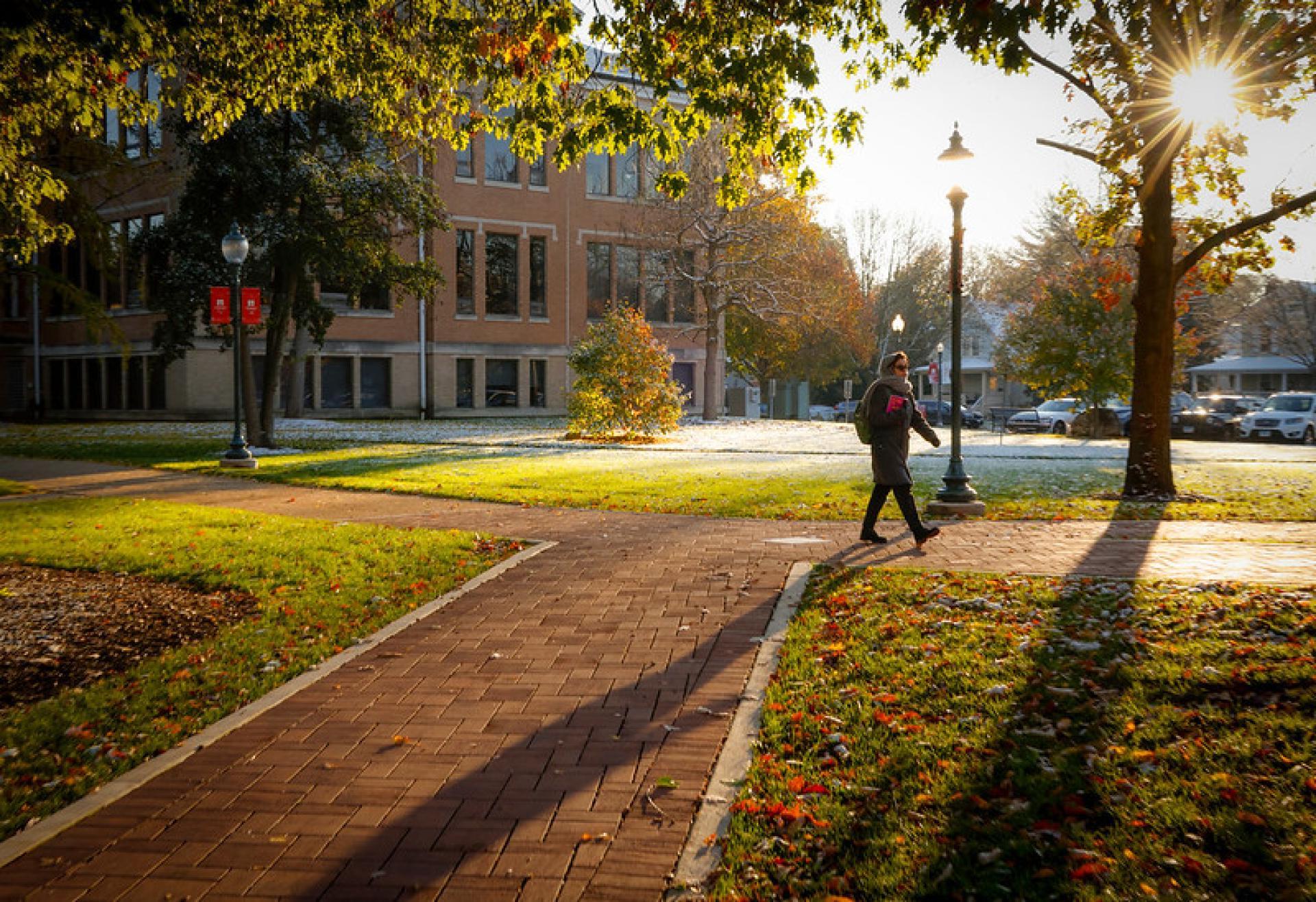 A 中北书院 student walking from a parking lot to class.