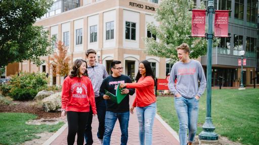 Group of students walking along central campus