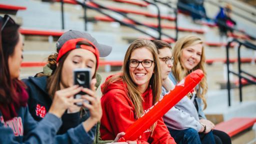 students at football game