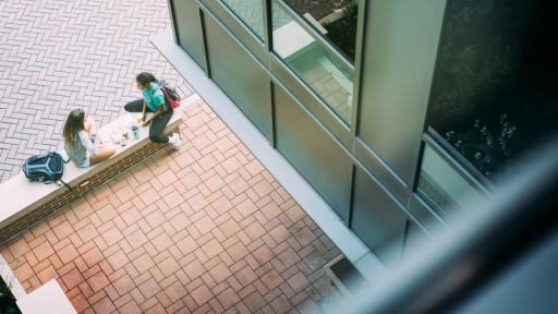 students sitting on campus