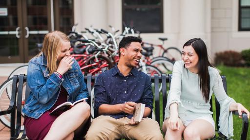 Students sitting on a bench